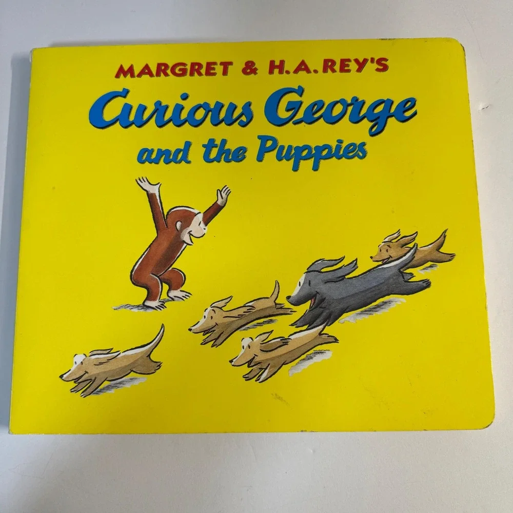 Curious George and the Puppies Lap Edition Board Book Margret & H.A. Rey